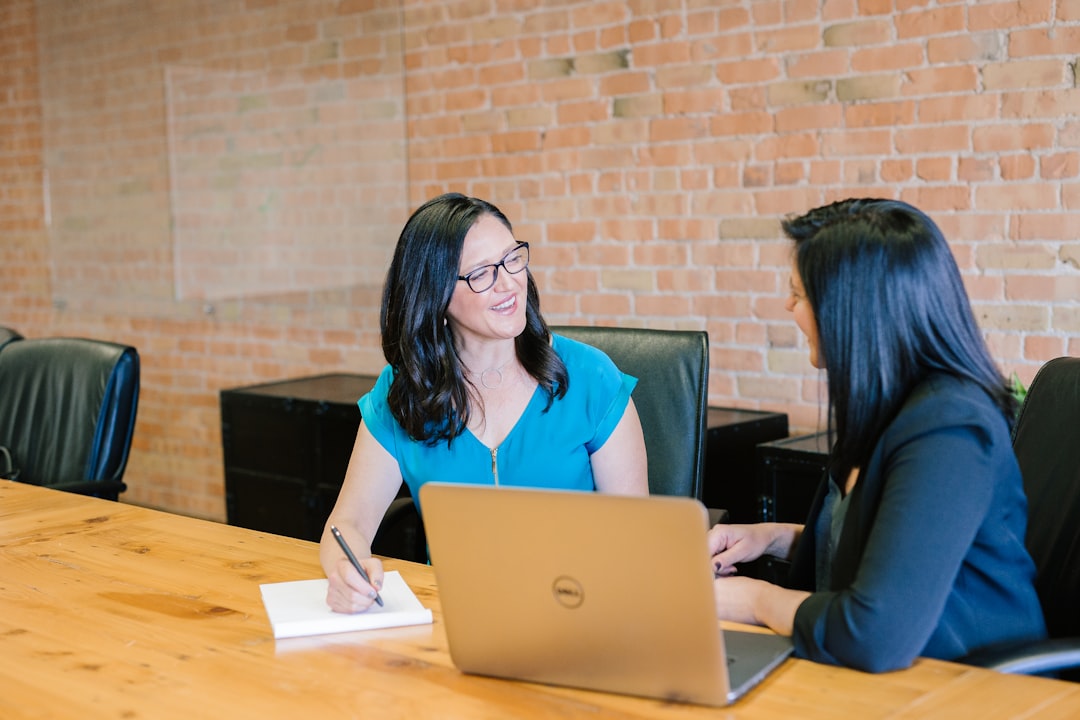 Advisor meeting with a client at a table